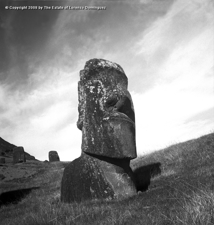 RRE_Hina_Riru_06.jpg - Easter Island. 1960. Moai on the exterior slope of Rano Raraku.  This moai is said to represent Hina-Riru, the first master sculptor who arrived on Easter Island with king Hotu Matu'a.