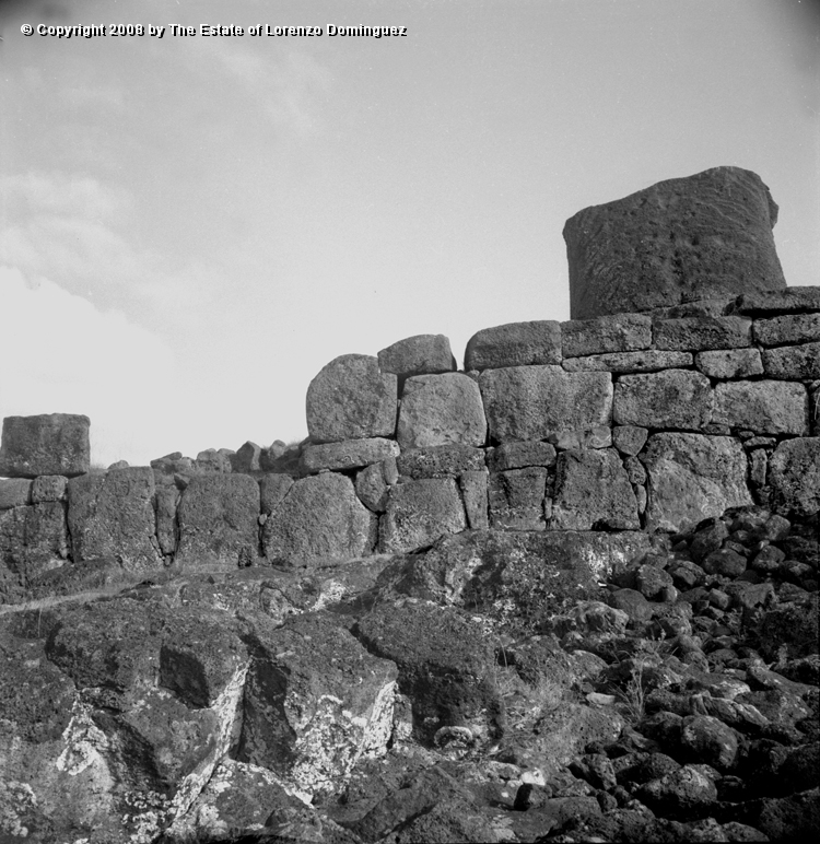TAM_Ahu_01.jpg - Easter Island. 1960. Ahu Tongariki. The ahu wall with rests of a moai still standing. Photograph taken shortly before the destruction of the ahu by the tsunami of May 22, 1960.